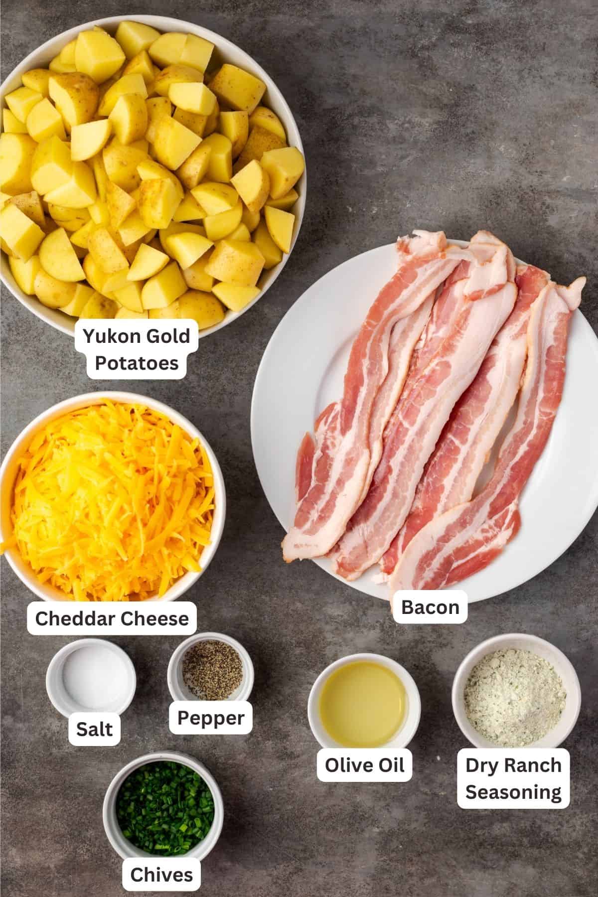 Ingredients for cheesy ranch potatoes with text labels overlaying each ingrededient.