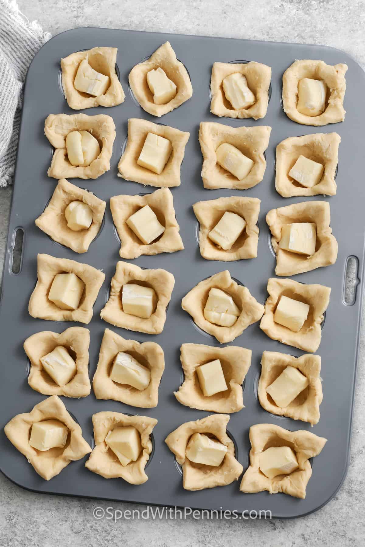 adding brie to Cranberry Brie Bites