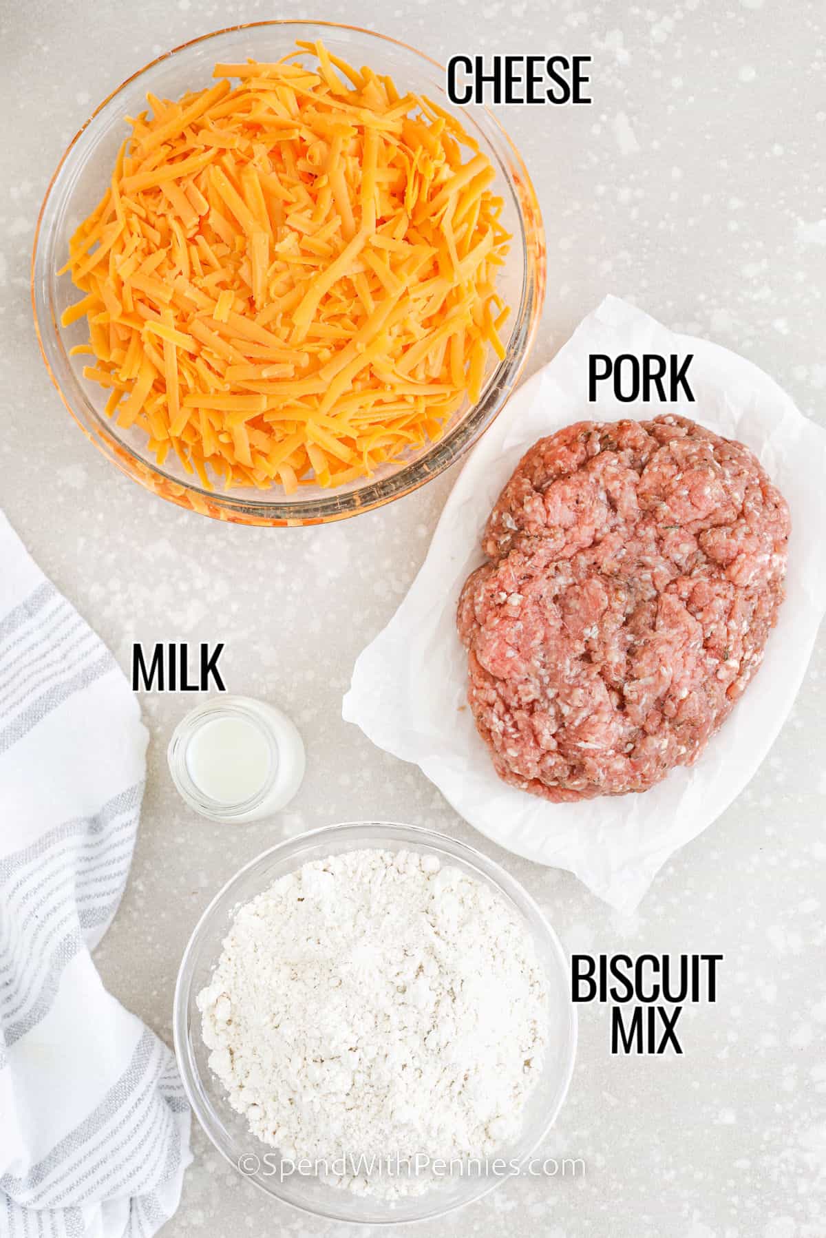 pork , cheese , milk and biscuit mix with labels to make Sausage Balls