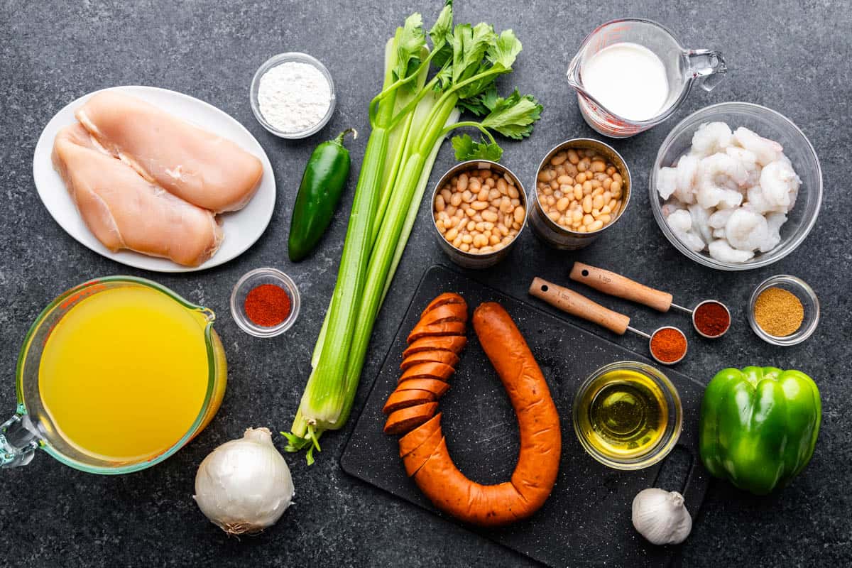 An overhead view of the ingredients needed to make Cajun white chicken chili.