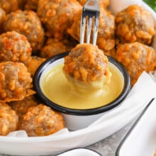 dipping Sausage Balls in sauce