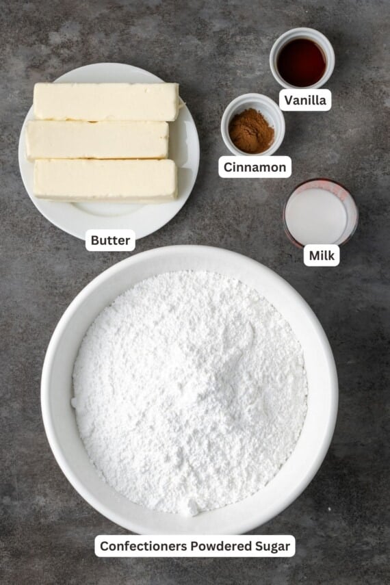 Ingredients for cinnamon frosting with text labels overlaying each ingredient.