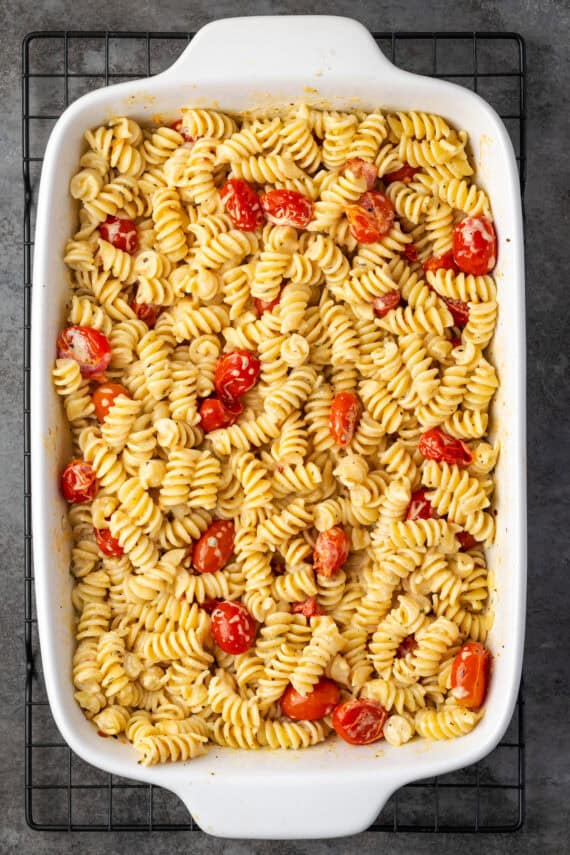 Overhead view of Boursin cheese pasta in a white ceramic casserole dish.