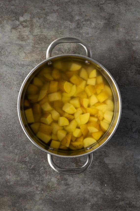 Diced potatoes in a pot of boiling water.