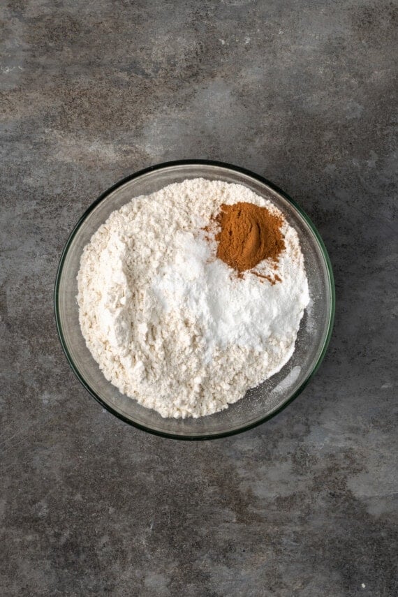 Dry cupcake ingredients combined in a glass mixing bowl.